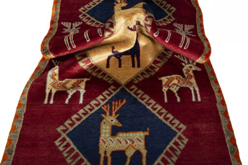 Corner detail of 2000s Persian Gabbeh rug showing border pattern and Wool pile