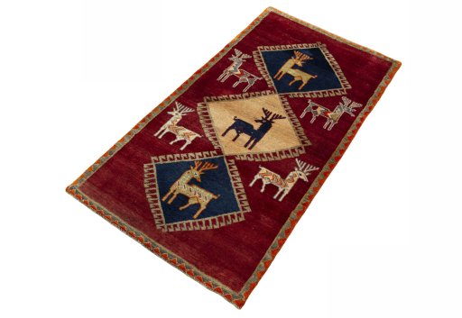 Corner detail of 2000s Persian Gabbeh rug showing border pattern and Wool pile