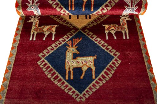 Full view of 2000s Persian Gabbeh rug from Iran / Persia, 193 × 100 cm in Red tones