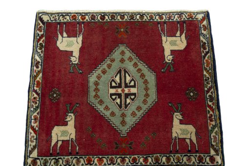 Surface texture of 2000s Persian Gabbeh rug with natural Wool and intricate pattern