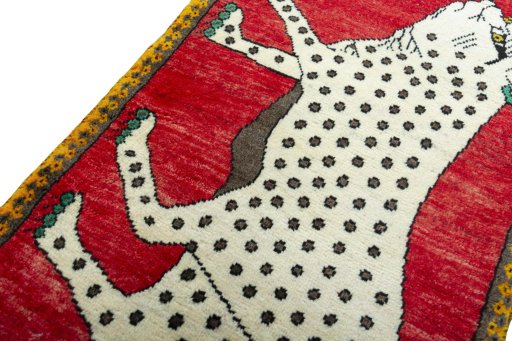 Backside of handmade 2000s Persian Gabbeh rug showing knot structure and weave density