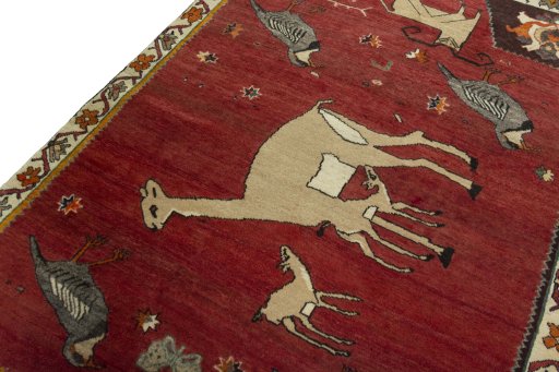 Backside of handmade 2000s Persian Gabbeh rug showing knot structure and weave density