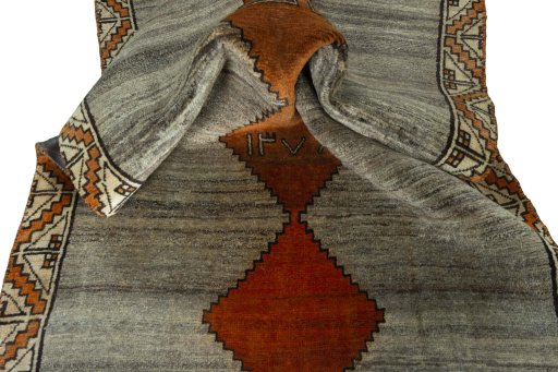 Corner detail of 2000s Persian Gabbeh rug showing border pattern and Wool pile