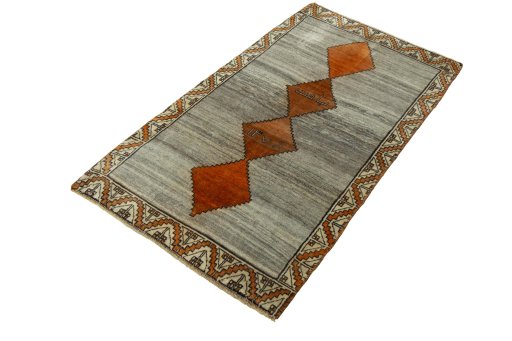 Corner detail of 2000s Persian Gabbeh rug showing border pattern and Wool pile