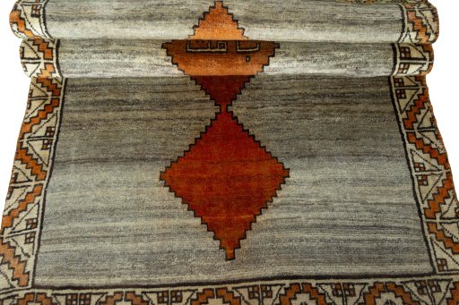 Full view of 2000s Persian Gabbeh rug from Iran / Persia, 196 × 107 cm in Beige tones