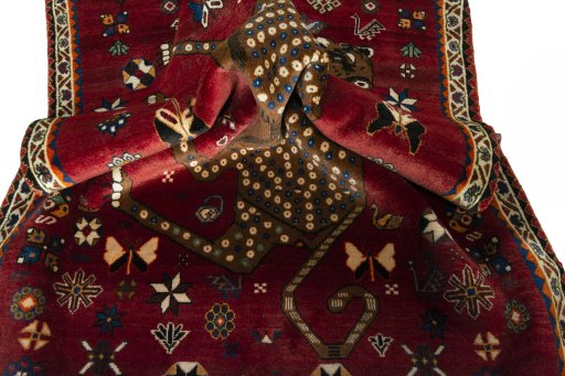 Corner detail of 2000s Persian Gabbeh rug showing border pattern and Wool pile