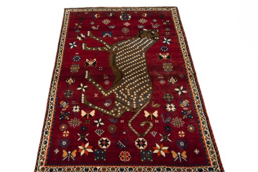 Surface texture of 2000s Persian Gabbeh rug with natural Wool and intricate pattern