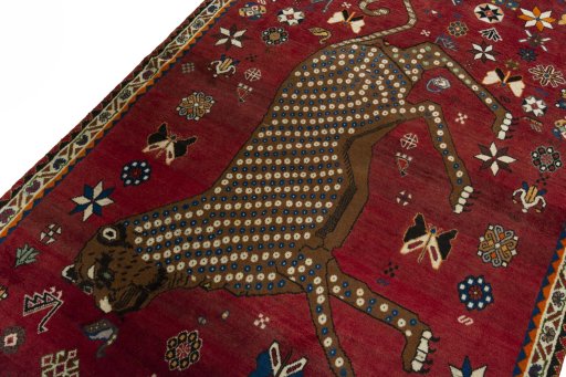 Backside of handmade 2000s Persian Gabbeh rug showing knot structure and weave density