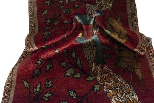 Corner detail of 2000s Persian Gabbeh rug showing border pattern and Wool pile