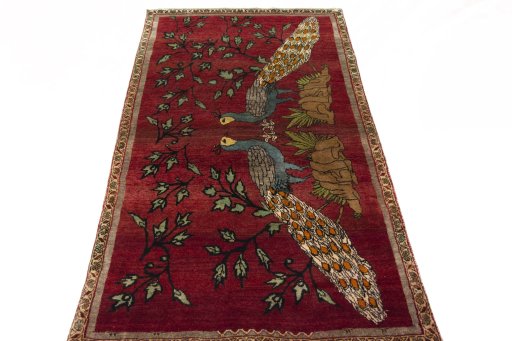Surface texture of 2000s Persian Gabbeh rug with natural Wool and intricate pattern