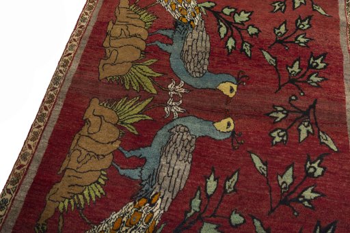 Backside of handmade 2000s Persian Gabbeh rug showing knot structure and weave density