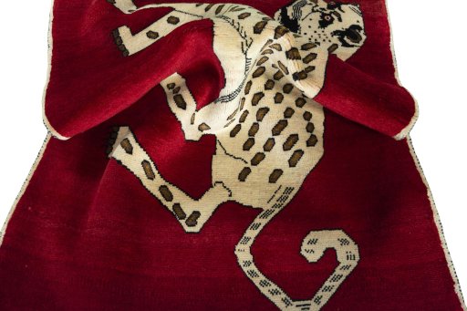 Corner detail of 2000s Persian Gabbeh rug showing border pattern and Wool pile