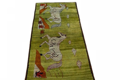 Surface texture of 2000s Persian Gabbeh rug with natural Wool and intricate pattern
