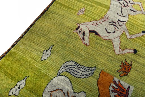 Backside of handmade 2000s Persian Gabbeh rug showing knot structure and weave density
