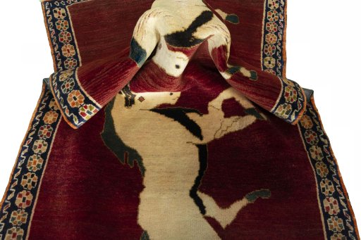 Corner detail of 2000s Persian Gabbeh rug showing border pattern and Wool pile