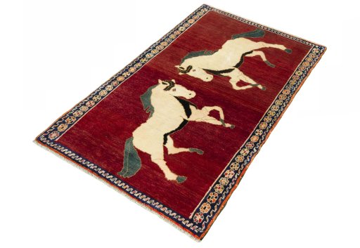 Corner detail of 2000s Persian Gabbeh rug showing border pattern and Wool pile
