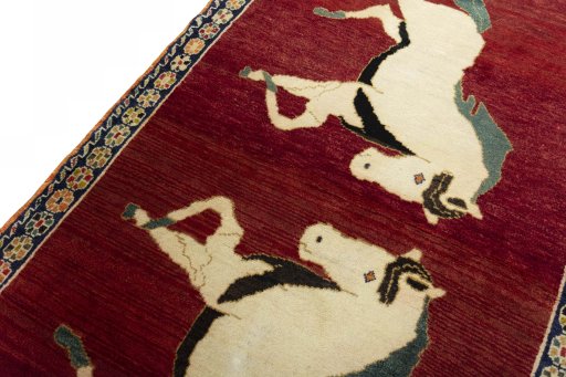 Backside of handmade 2000s Persian Gabbeh rug showing knot structure and weave density