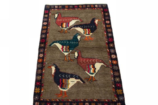 Surface texture of 2000s Persian Gabbeh rug with natural Wool and intricate pattern