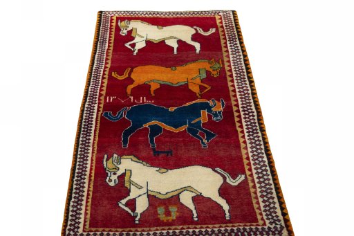 Surface texture of 2000s Persian Gabbeh rug with natural Wool and intricate pattern