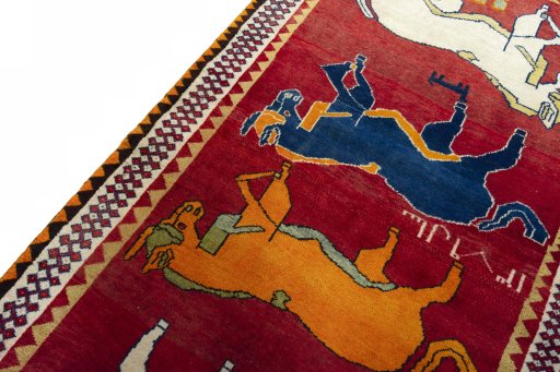 Backside of handmade 2000s Persian Gabbeh rug showing knot structure and weave density