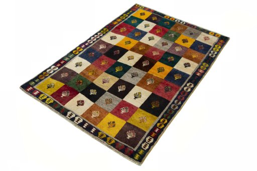 Corner detail of 2000s Persian Gabbeh rug showing border pattern and Wool pile