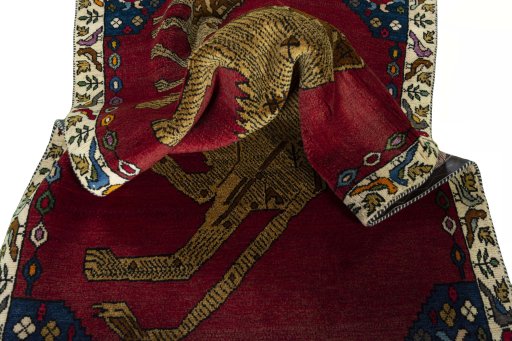 Corner detail of 2000s Persian Gabbeh rug showing border pattern and Wool pile