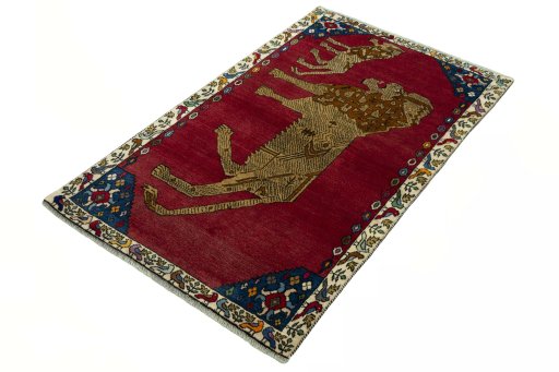 Corner detail of 2000s Persian Gabbeh rug showing border pattern and Wool pile