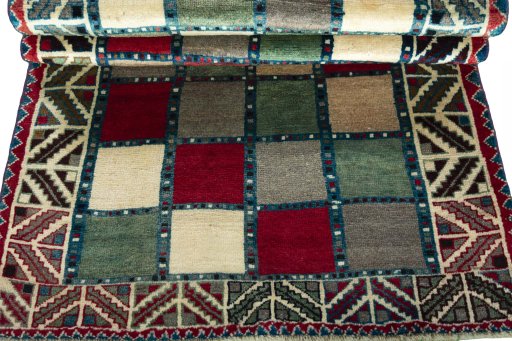 Full view of 2000s Persian Gabbeh rug from Iran / Persia, 183 × 107 cm in Multi Color tones