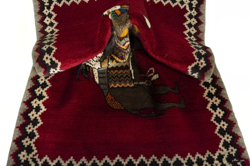 Corner detail of 2000s Persian Gabbeh rug showing border pattern and Wool pile