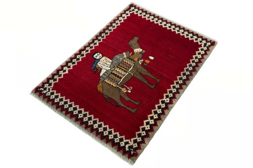 Corner detail of 2000s Persian Gabbeh rug showing border pattern and Wool pile