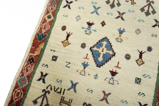 Backside of handmade New Persian Gabbeh rug showing knot structure and weave density