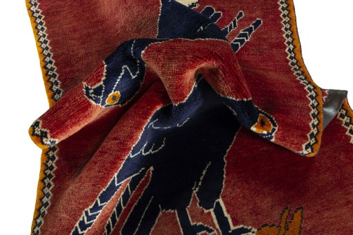 Corner detail of 2000s Persian Gabbeh rug showing border pattern and Wool pile