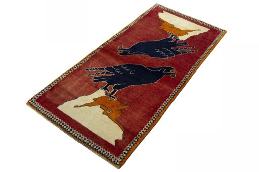 Corner detail of 2000s Persian Gabbeh rug showing border pattern and Wool pile