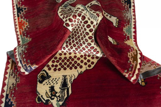 Corner detail of 2000s Persian Gabbeh rug showing border pattern and Wool pile