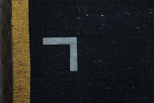 Corner detail of New Persian Gabbeh rug showing border pattern and Wool pile