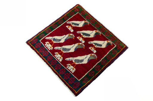 Corner detail of 2000s Persian Gabbeh rug showing border pattern and Wool pile