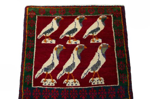 Surface texture of 2000s Persian Gabbeh rug with natural Wool and intricate pattern