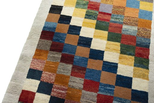 Backside of handmade 2000s Persian Gabbeh rug showing knot structure and weave density