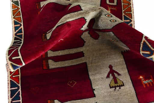 Corner detail of 2000s Persian Gabbeh rug showing border pattern and Wool pile