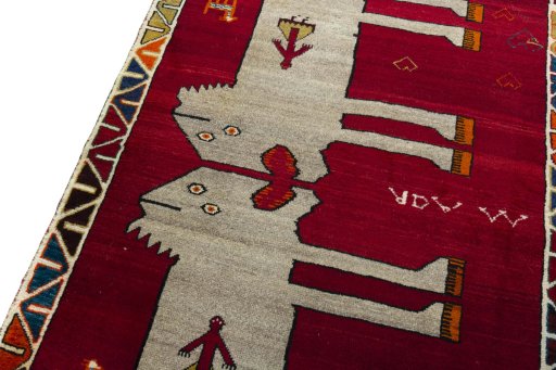 Backside of handmade 2000s Persian Gabbeh rug showing knot structure and weave density