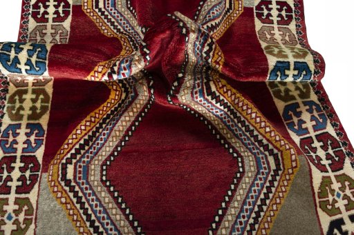 Corner detail of 2000s Persian Gabbeh rug showing border pattern and Wool pile