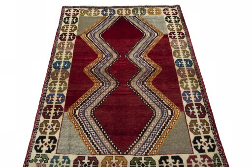 Surface texture of 2000s Persian Gabbeh rug with natural Wool and intricate pattern