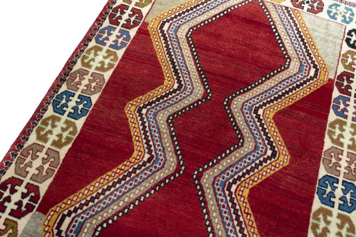 Backside of handmade 2000s Persian Gabbeh rug showing knot structure and weave density