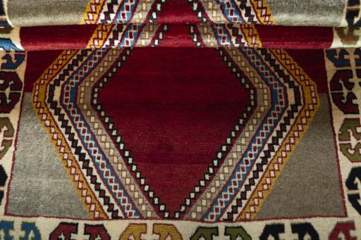 Full view of 2000s Persian Gabbeh rug from Iran / Persia, 168 × 110 cm in Red tones