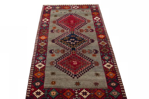 Surface texture of 2000s Persian Gabbeh rug with natural Wool and intricate pattern