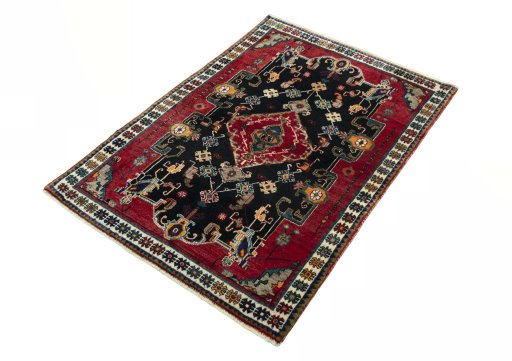 Corner detail of 2000s Persian Gabbeh rug showing border pattern and Wool pile
