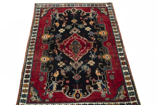 Surface texture of 2000s Persian Gabbeh rug with natural Wool and intricate pattern
