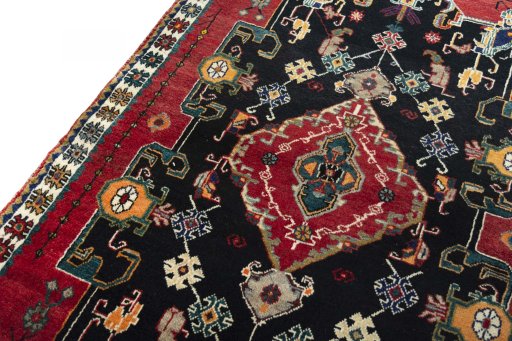 Backside of handmade 2000s Persian Gabbeh rug showing knot structure and weave density