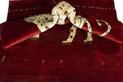 Corner detail of 2000s Persian Gabbeh rug showing border pattern and Wool pile
