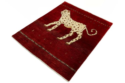 Corner detail of 2000s Persian Gabbeh rug showing border pattern and Wool pile